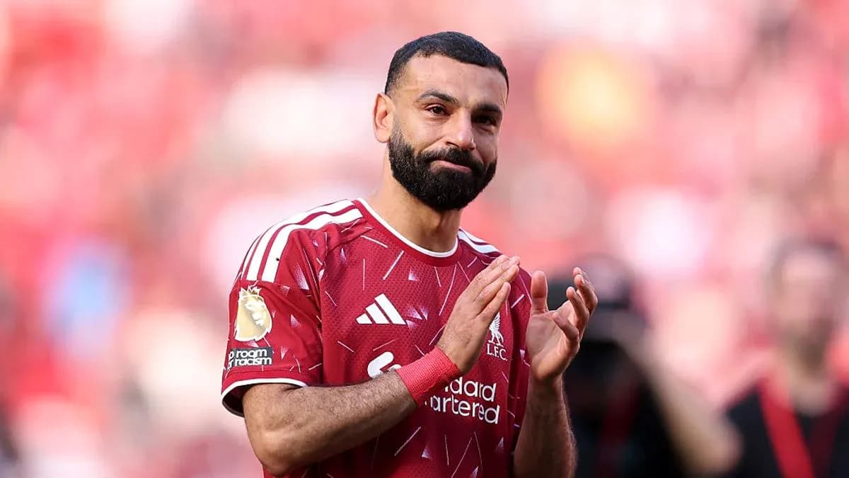 Player applauding fans during a match at Anfield