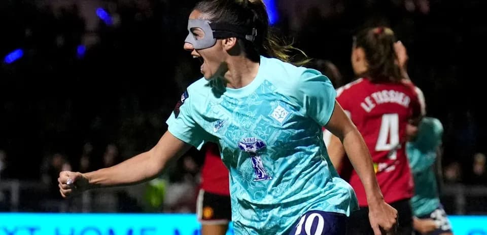 Player celebrating a goal in teal jersey