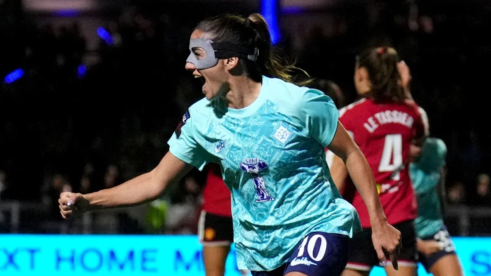 Player celebrating a goal in teal jersey