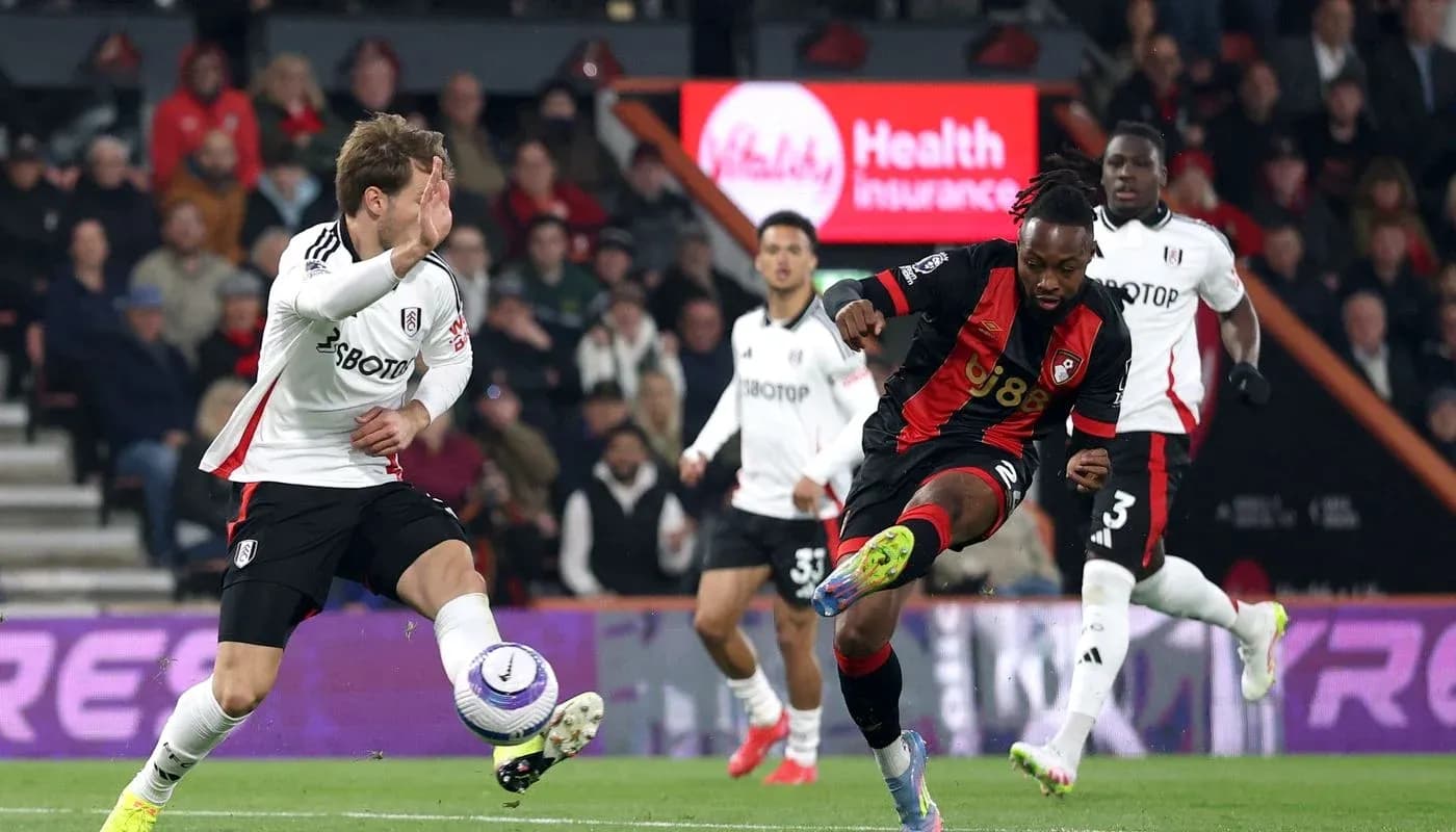 Fulham player challenges Bournemouth opponent during match