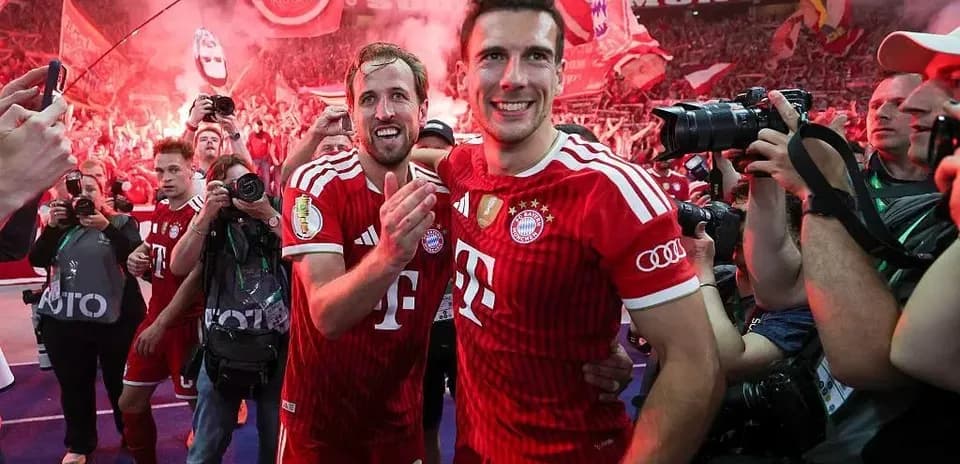 Bayern Munich players celebrating with fans after victory
