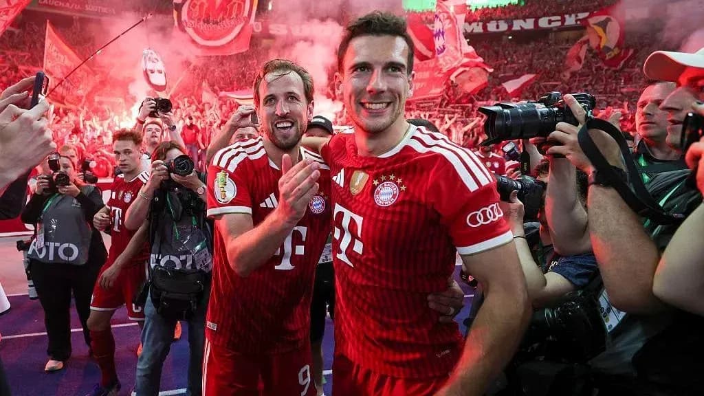 Bayern Munich players celebrating with fans after victory