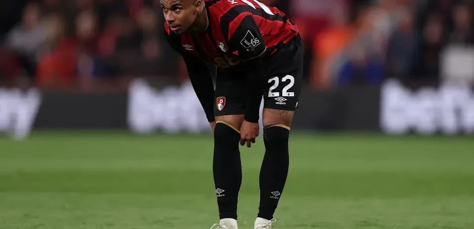 Bournemouth player bending over on the field