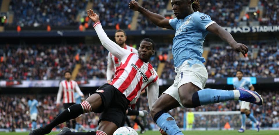 Player tackling opponent during a football match