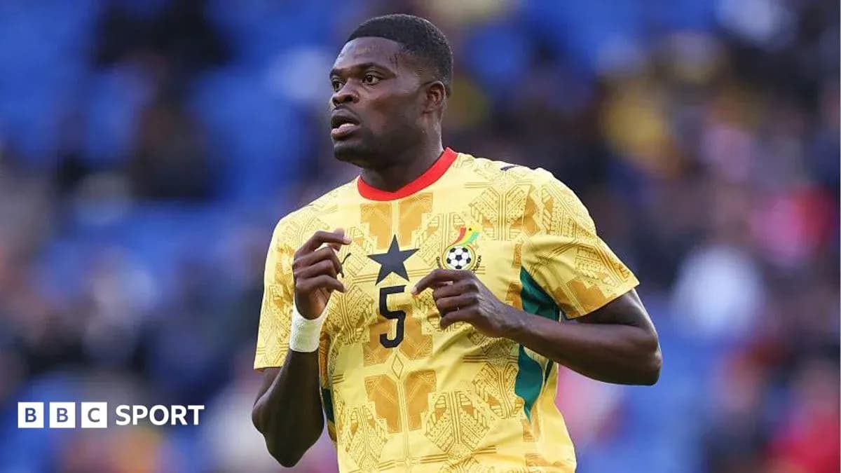 Player wearing Ghana jersey during match action