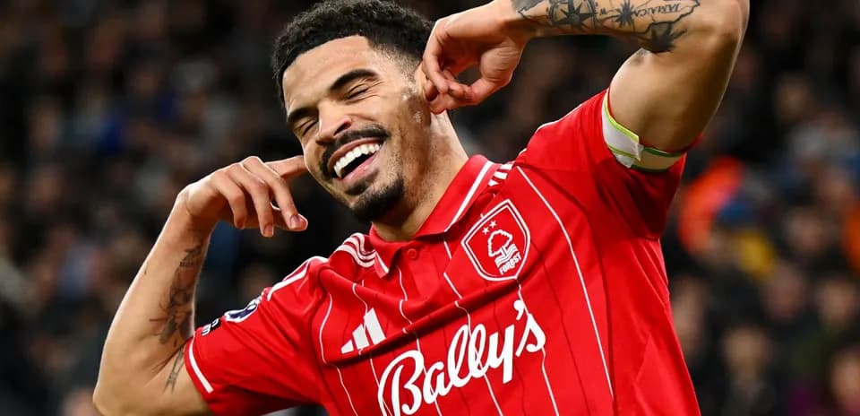 Player celebrating a goal with hands by ears