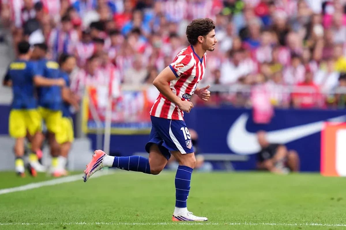 Player wearing Atlético Madrid kit running on field