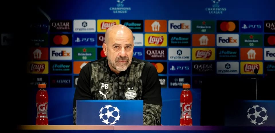 Coach at Champions League press conference podium