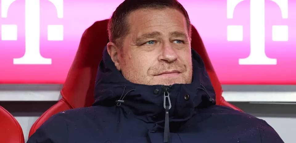 Coach sitting on the bench during match