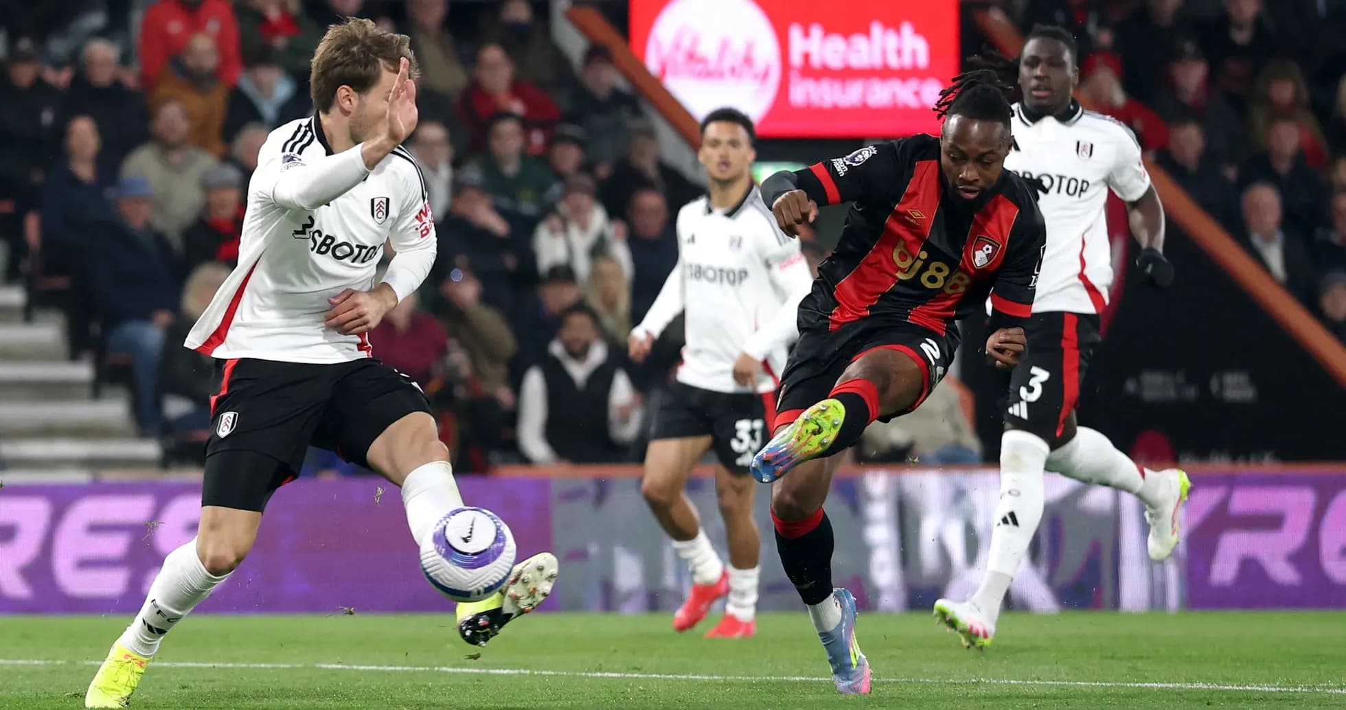 Fulham and Bournemouth players contesting the ball
