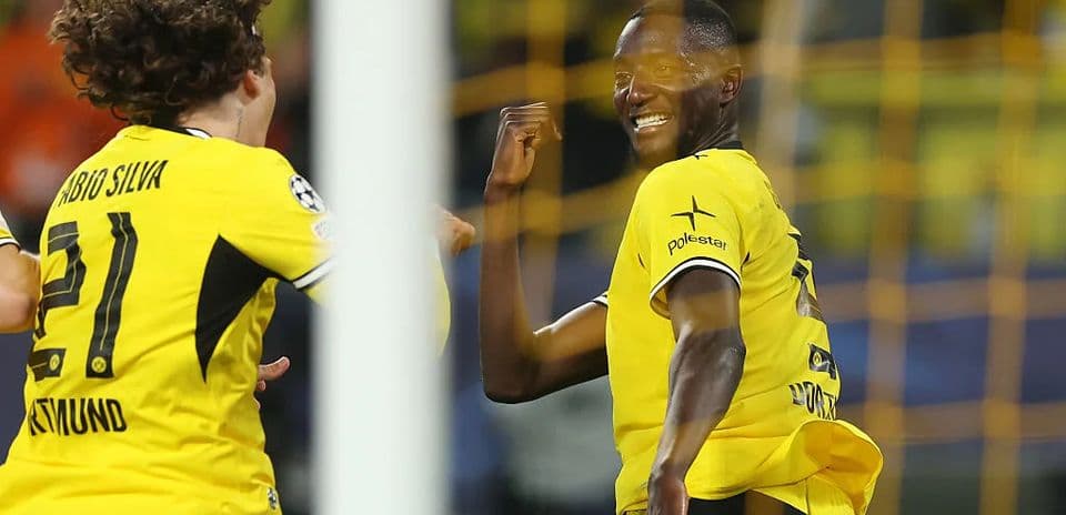 Players celebrating a goal during Champions League match