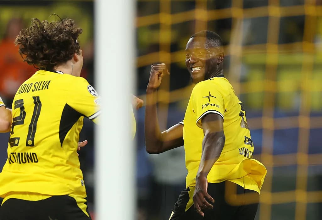 Players celebrating a goal during Champions League match