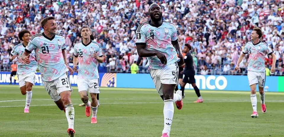 Players celebrating after scoring a goal during match
