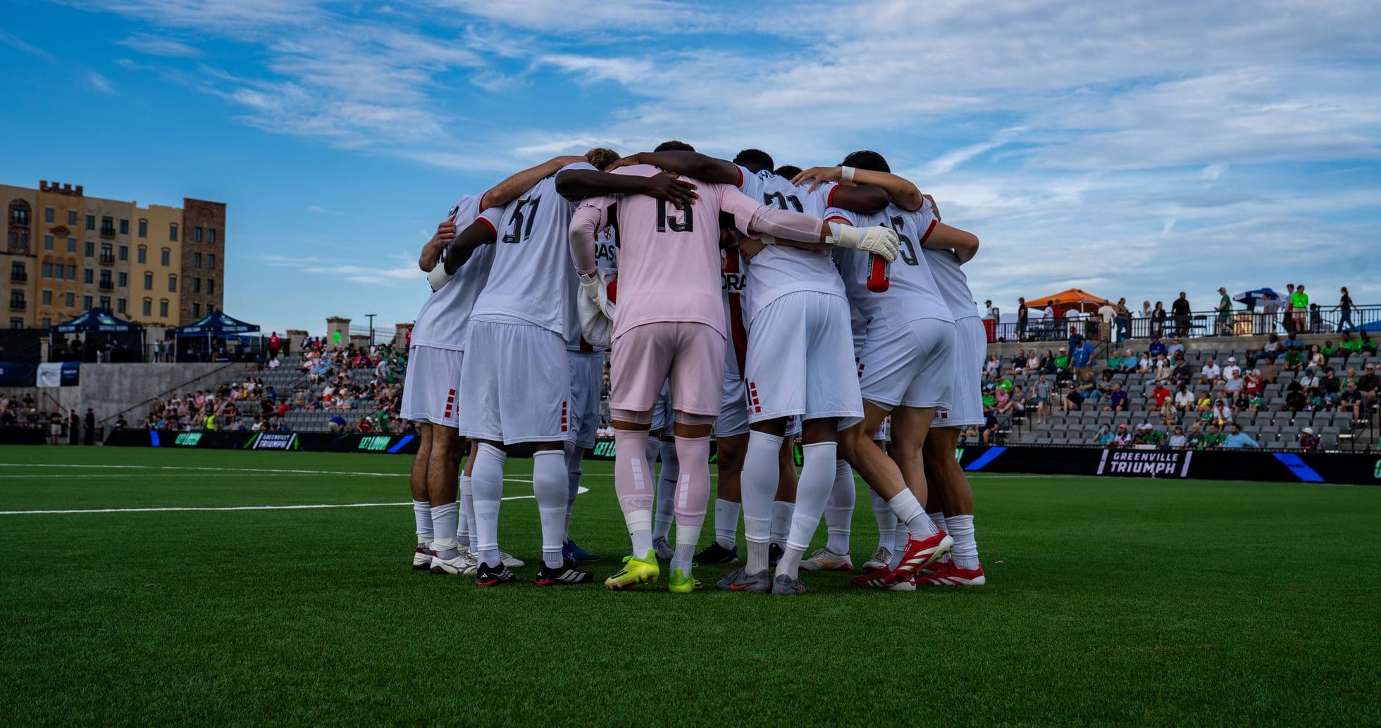 Greenville Triumph players huddling before match