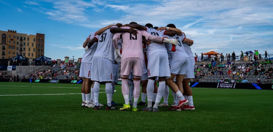 Greenville Triumph players huddling before match