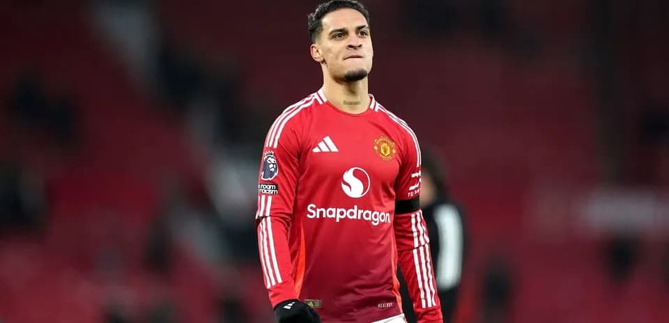 Player celebrating on the pitch in Manchester United kit
