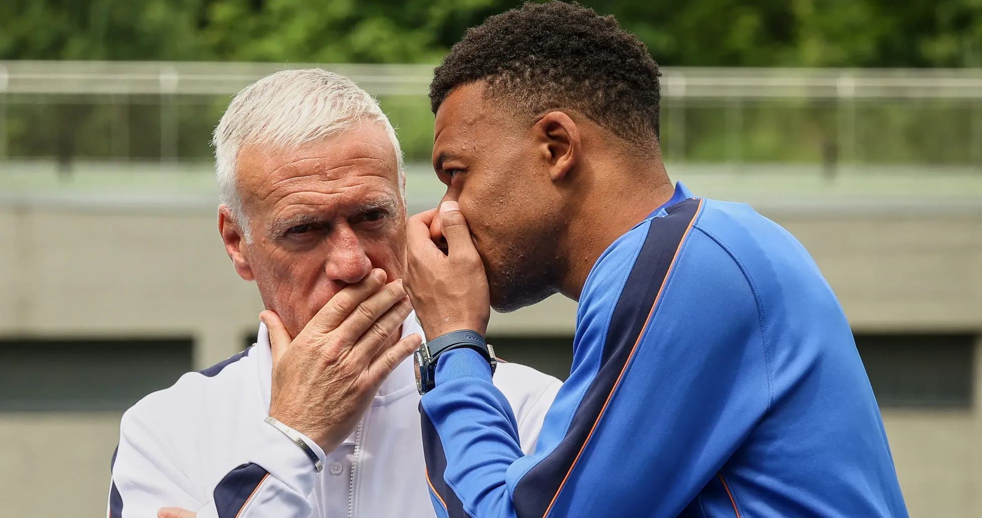Player and coach discussing strategy during training