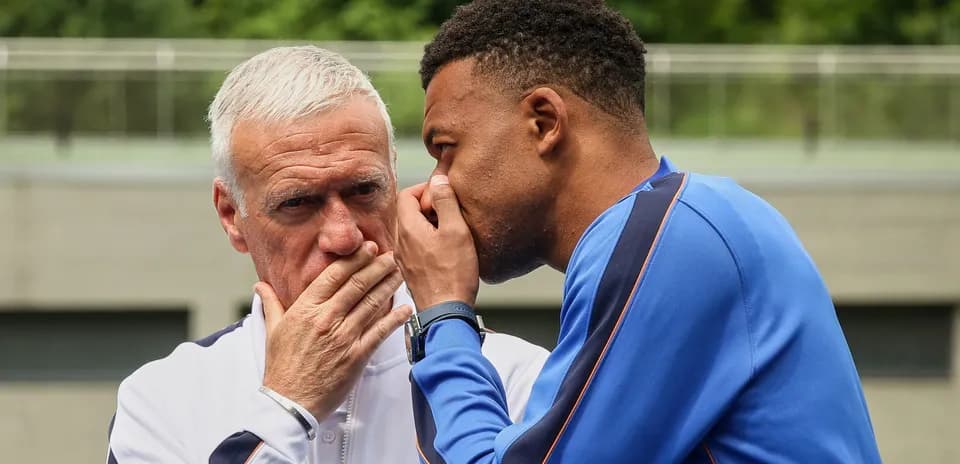 Player and coach discussing strategy during training