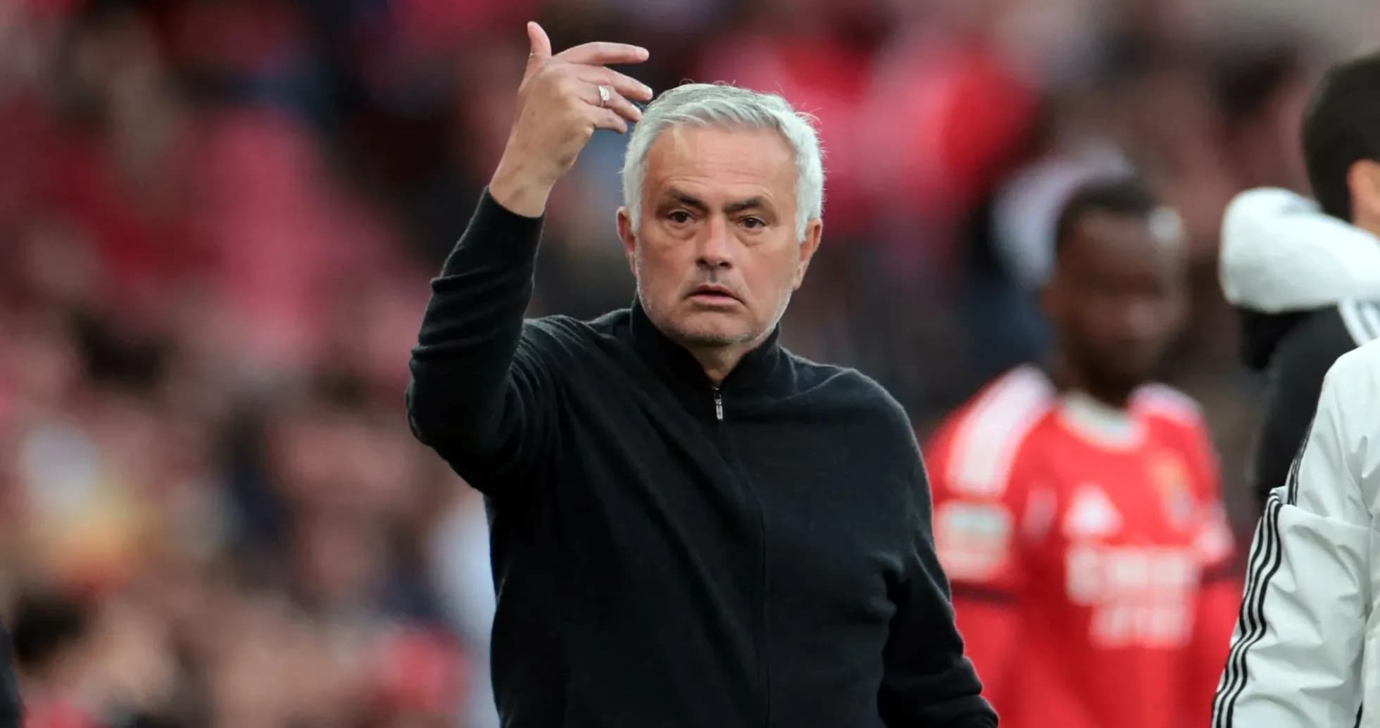 Manager gesturing during a football match