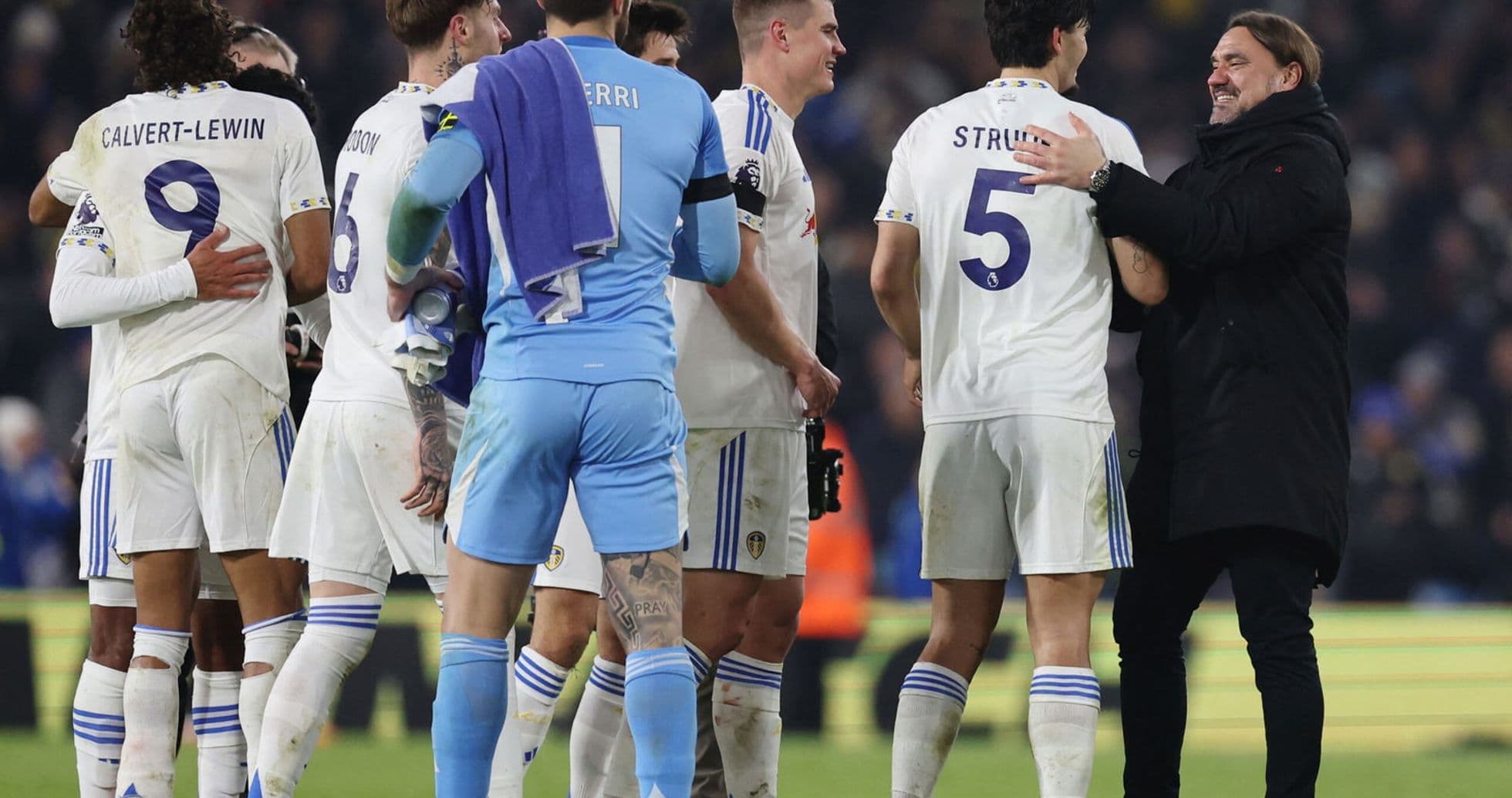 Leeds players celebrating a goal against Chelsea.