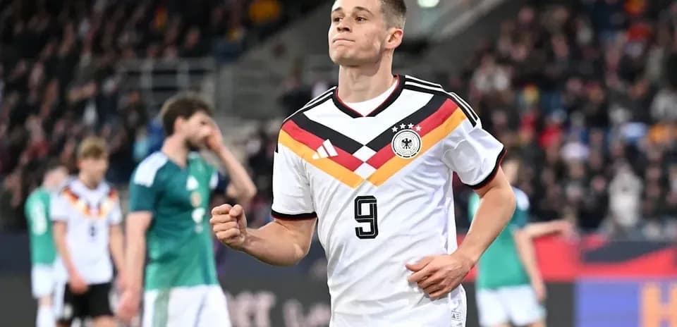German player celebrating after scoring a goal