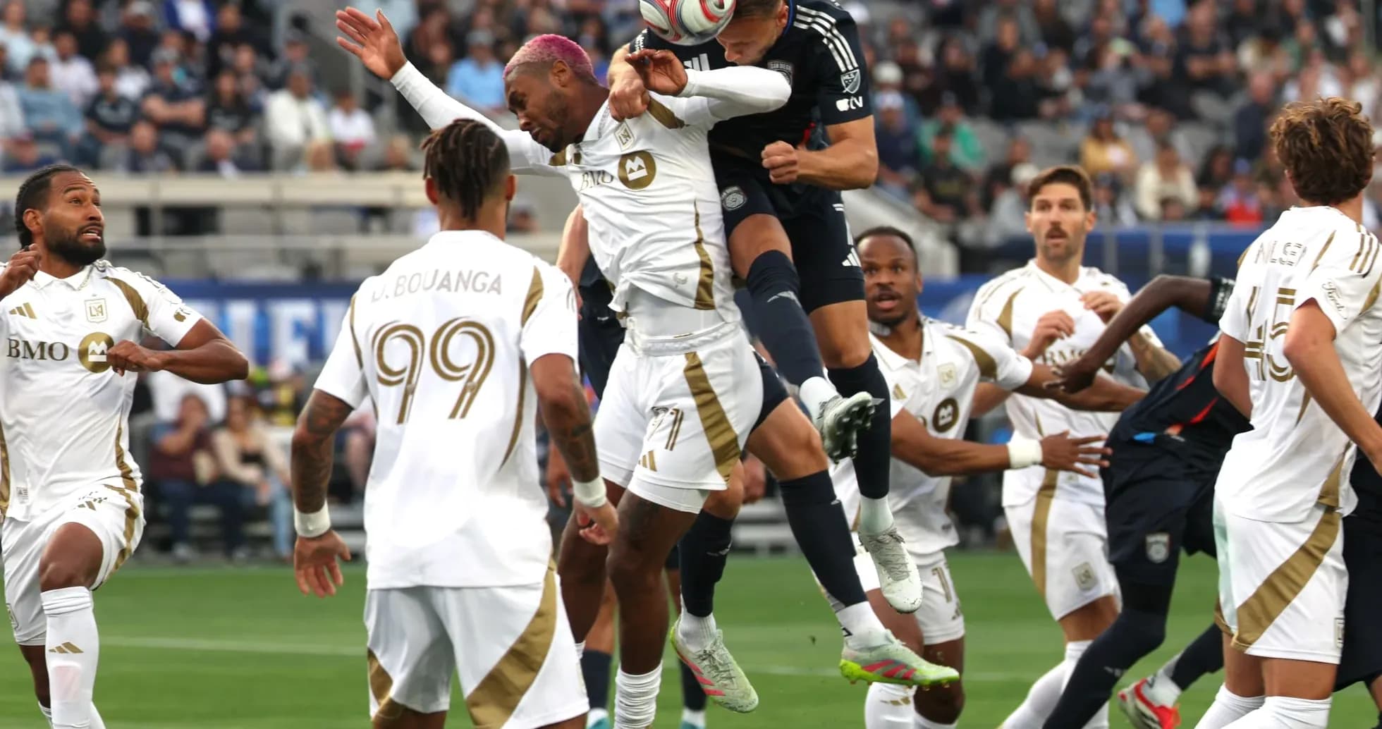 Players contesting for the ball during match