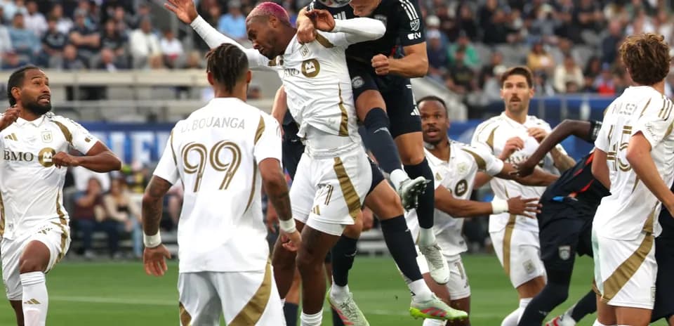 Players contesting for the ball during match