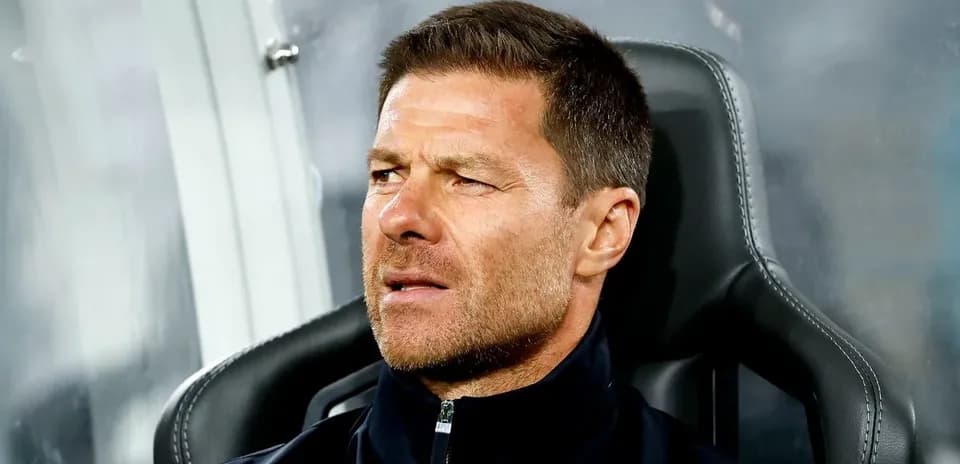 Coach sitting on bench during a match