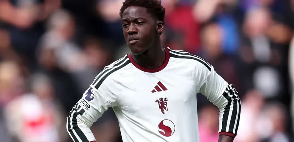 Player in white kit during match on field
