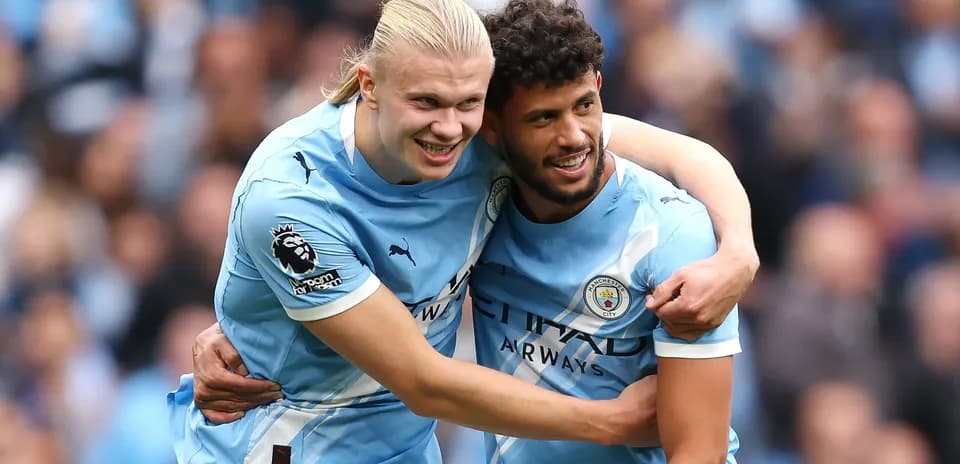 Manchester City players celebrating a goal