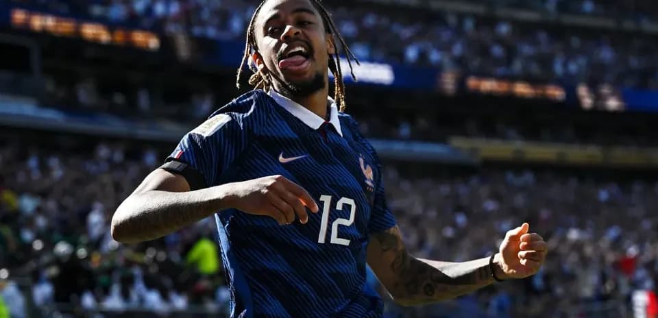 Player celebrating during match with crowd in background