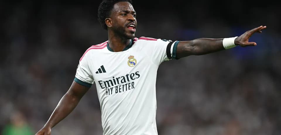Player gesturing during match in Real Madrid jersey