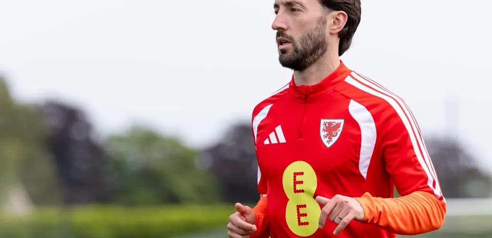Player jogging during training session in red kit