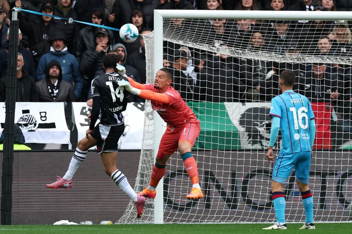 Goalkeeper challenges striker during Serie A match
