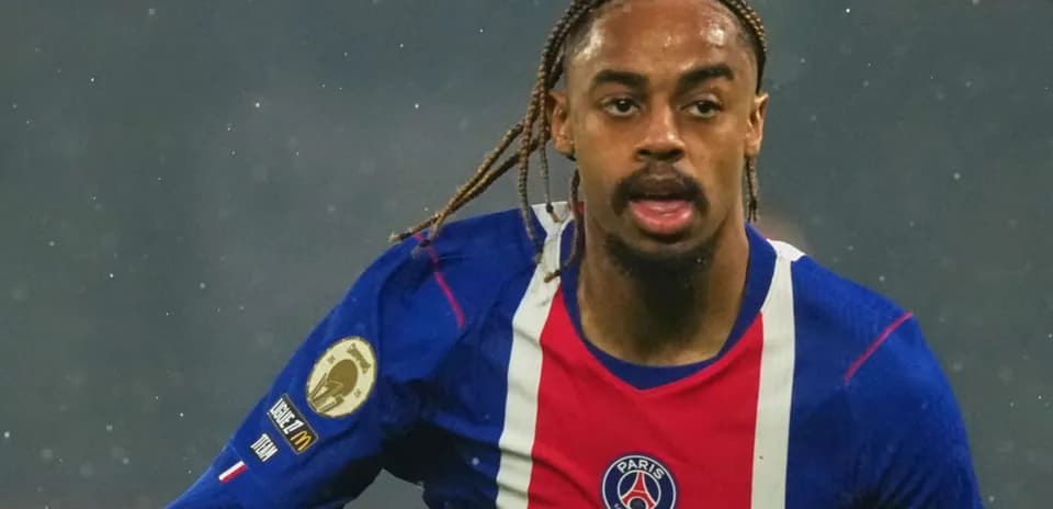 Player in action wearing PSG jersey during match