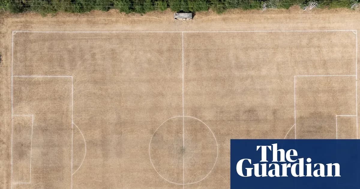 Aerial view of a dry, marked football pitch