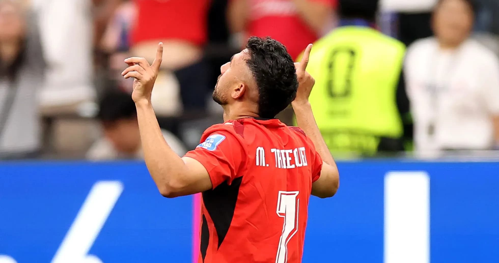 Player celebrating a goal with raised hands