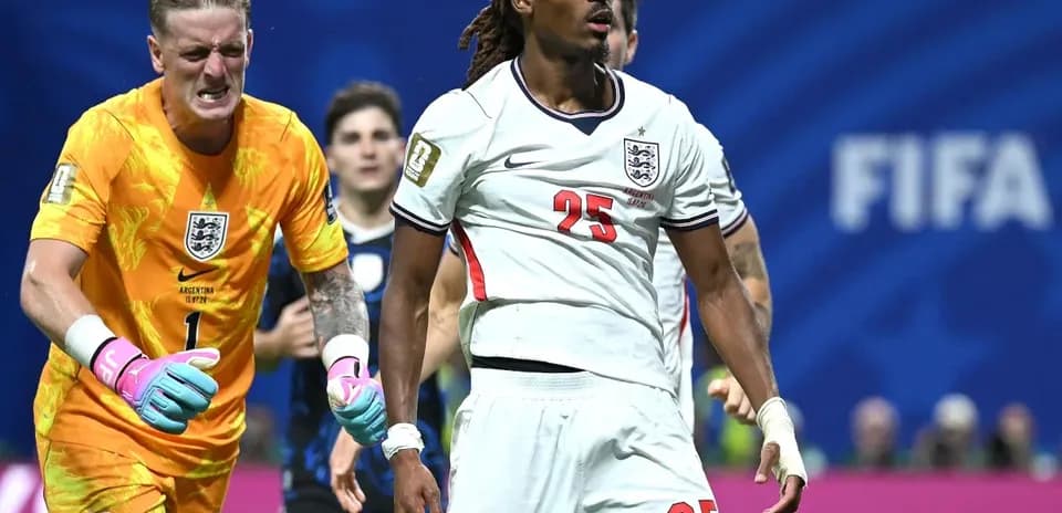 Goalkeeper and defender reacting during a match