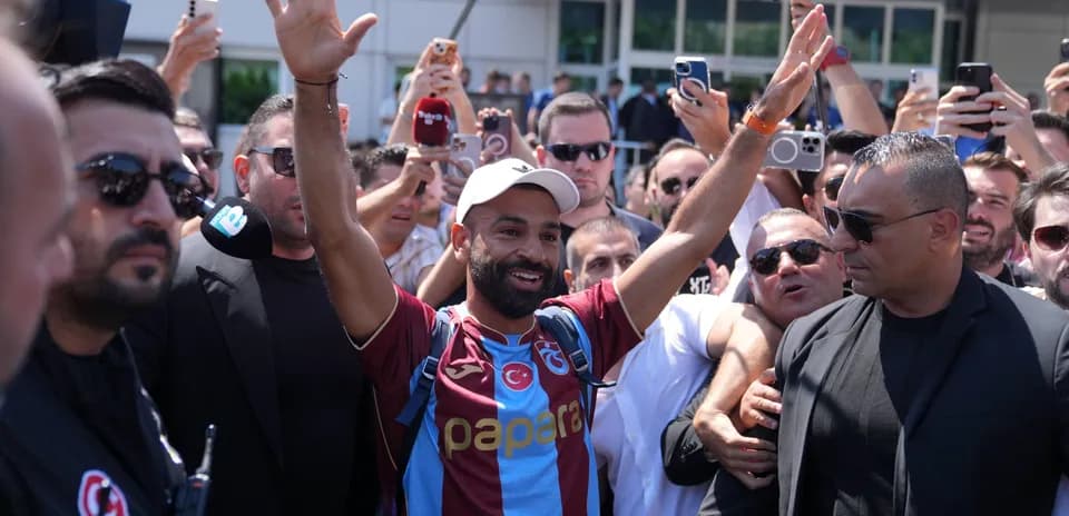 Player in Trabzonspor jersey greeted by fans