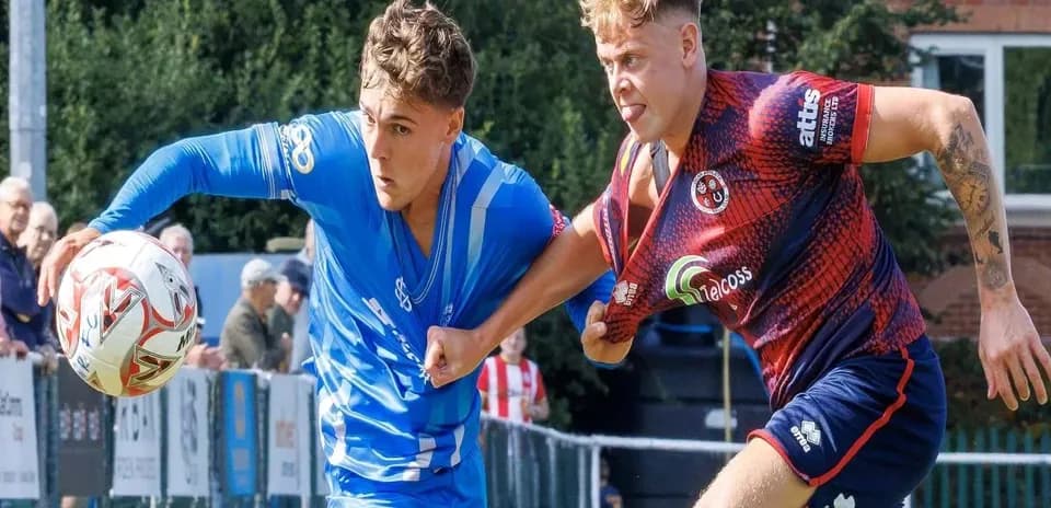 Two players contesting the ball during a match