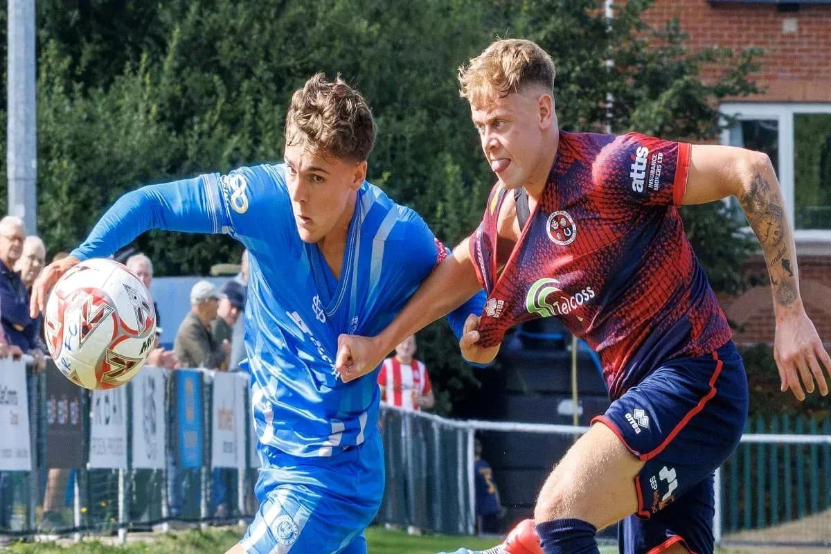 Two players contesting the ball during a match