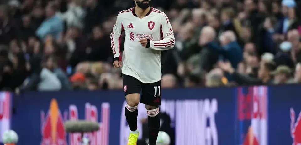 Player in Liverpool kit running on the pitch