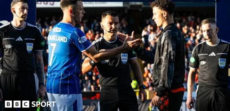 Players and referees interacting before the match