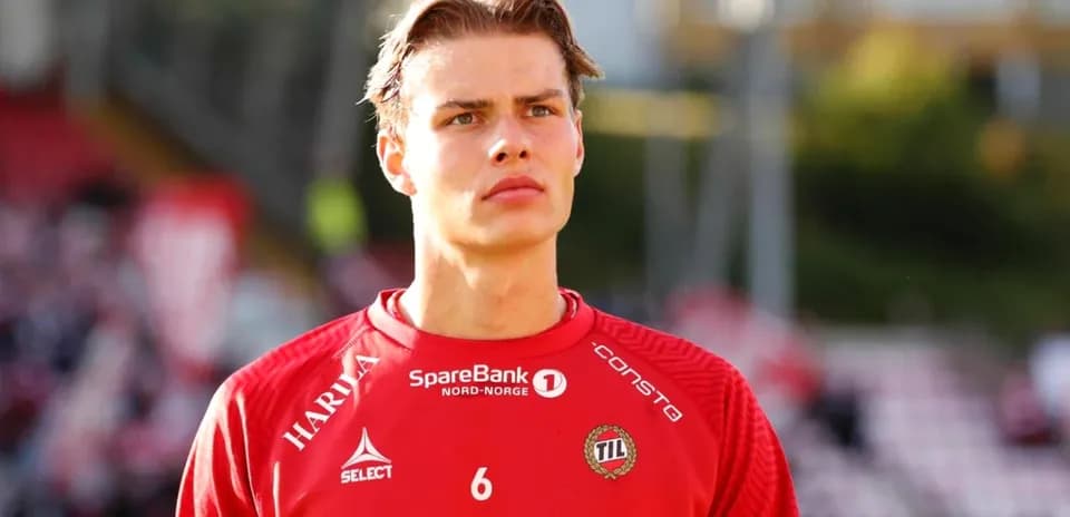 Player in red jersey preparing for match