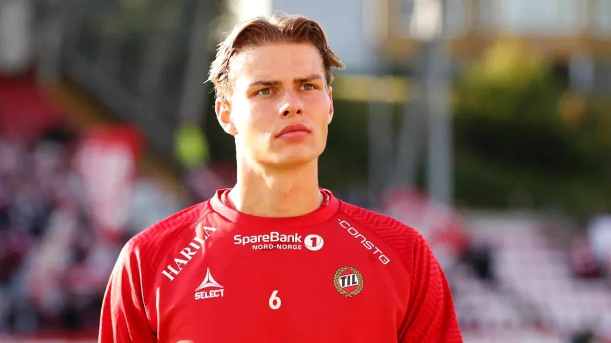 Player in red jersey preparing for match