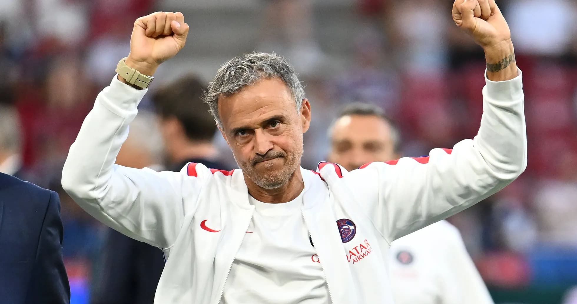 Manager celebrating with raised fists after match