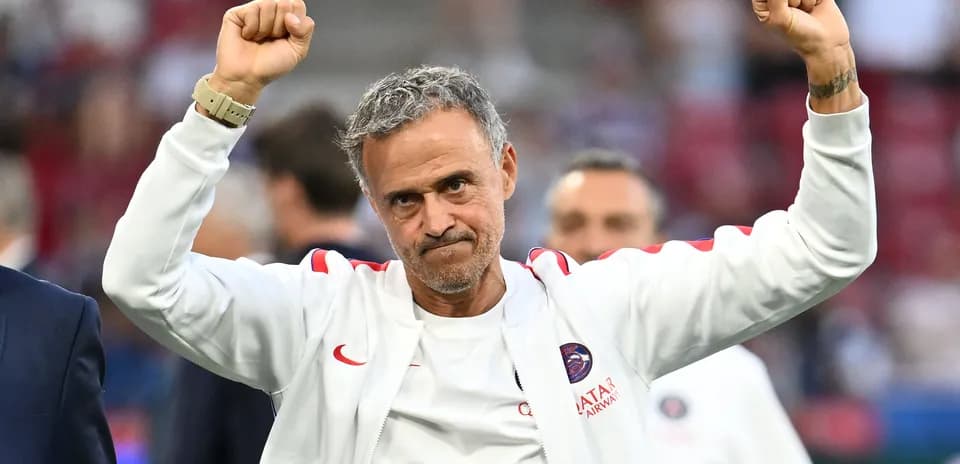 Manager celebrating with raised fists after match