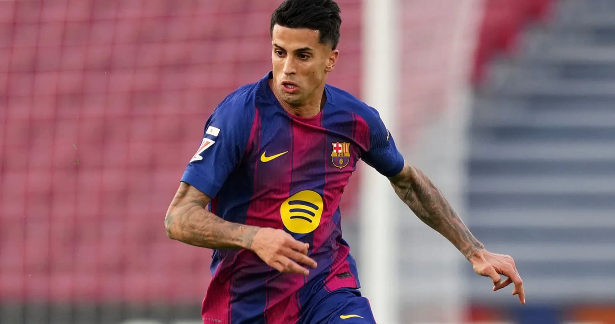 Player in Barcelona kit running on the pitch