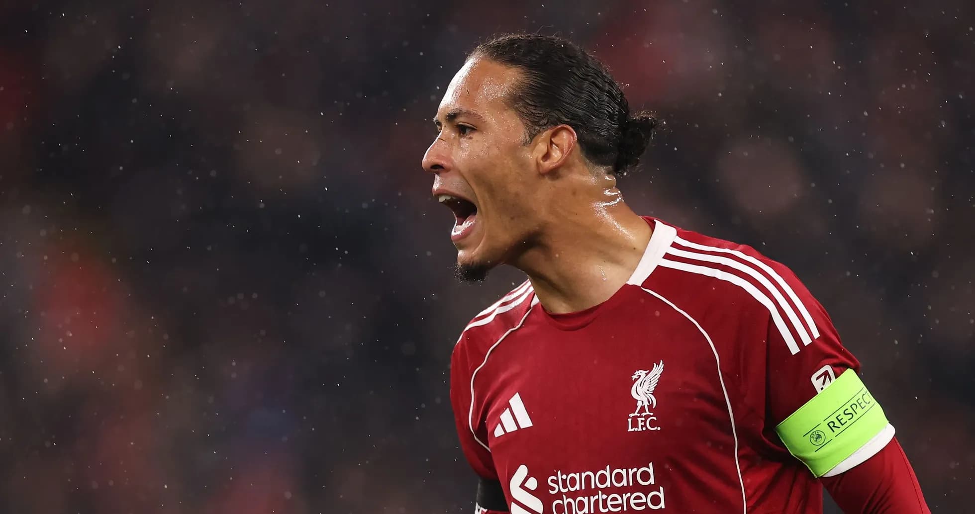 Player celebrating in Liverpool jersey during match