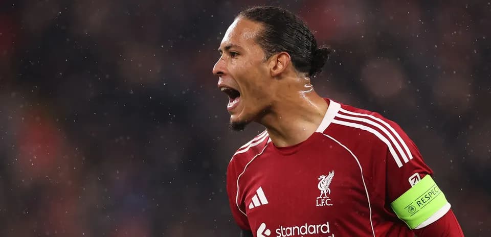 Player celebrating in Liverpool jersey during match
